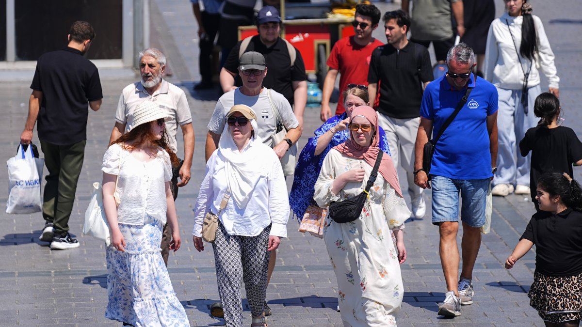 Turkish citizens and tourists walk in the historic Eminönü neighborhood on a hot summer day, Istanbul, Türkiye, June 29, 2026. (AA Photo)