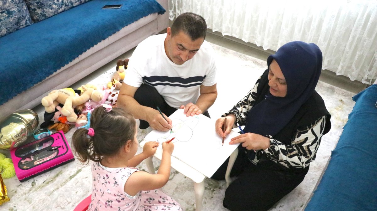 Gülcan and Hacı Cemil Bulut play with their foster daughter, Gaziantep, Türkiye, June 23, 2026. (AA Photo)