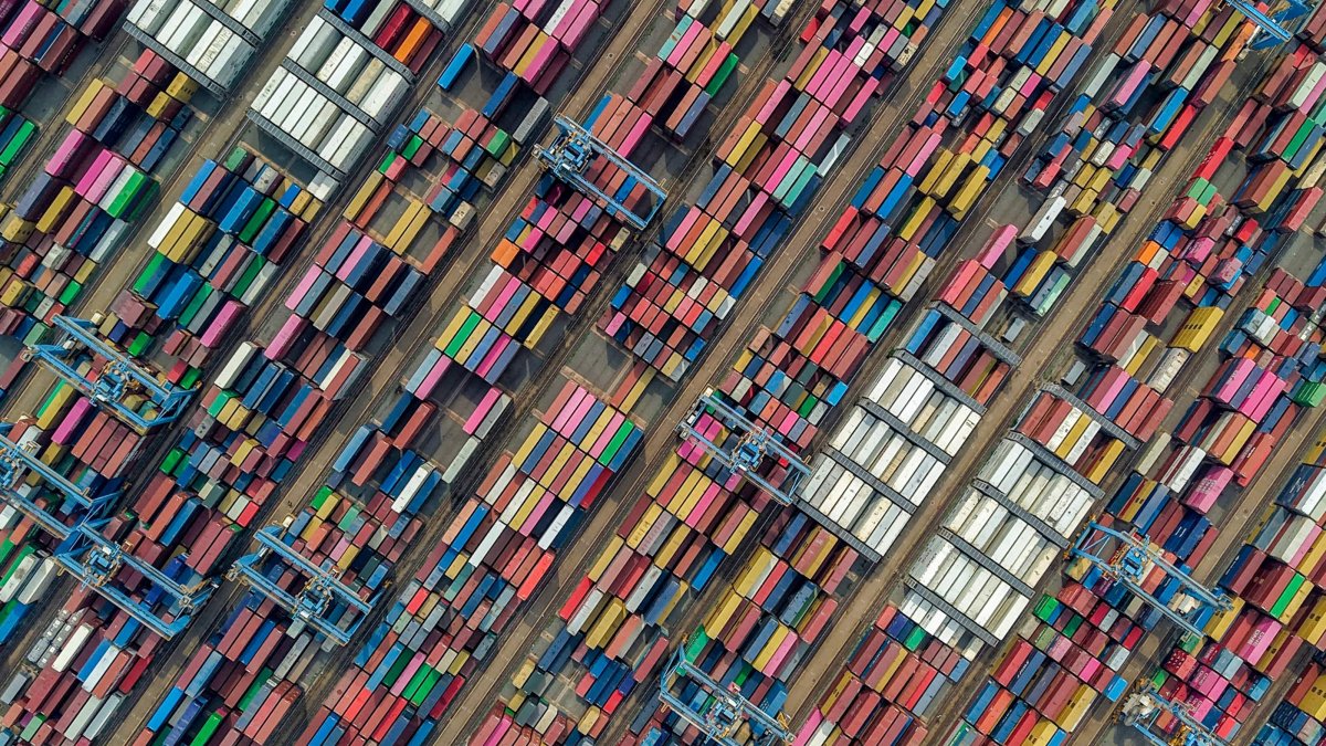 This aerial photo shows containers at a port, Qingdao, China, June 25, 2026. (AFP Photo)