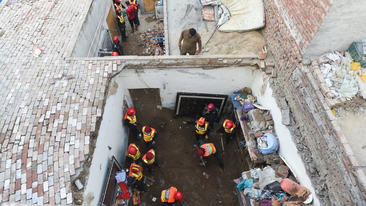 Rescue workers work at the site where children reportedly died after a tuition center roof collapsed, in Lahore, Pakistan, June 30, 2026. (Reuters Photo)