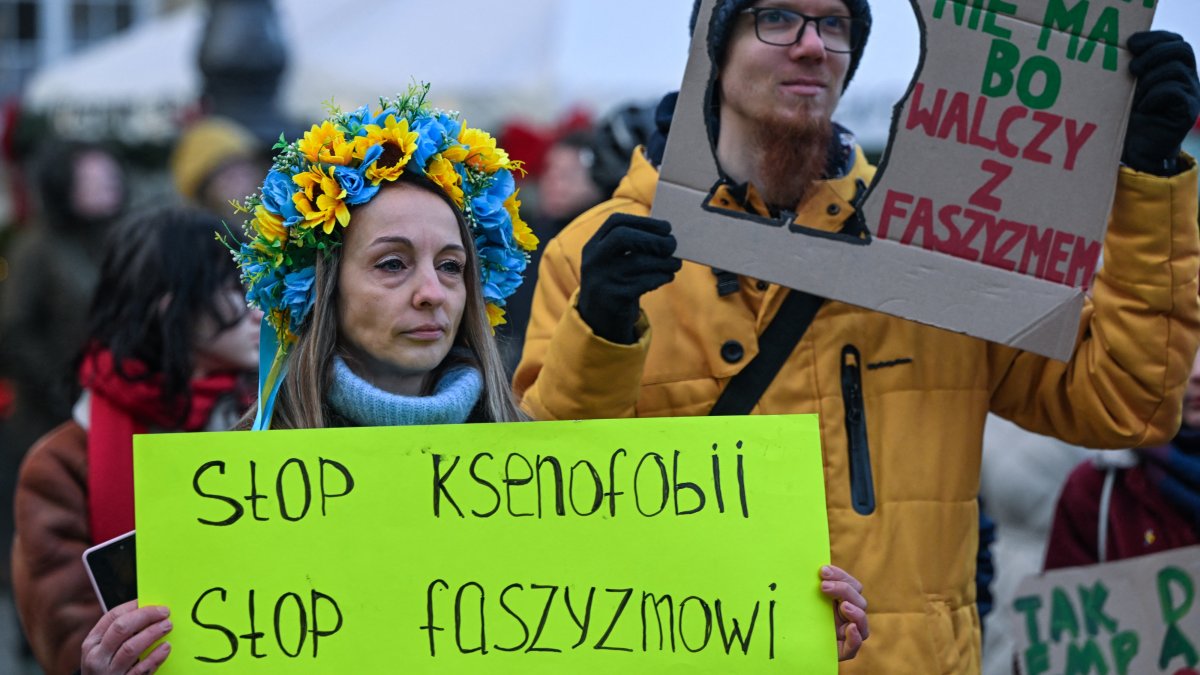 
A Ukrainian activist displays a placard reading 'Stop Ksenofobii, Stop Faszyzmowi' (Stop Xenophobia, Stop Fascism) during an Anti-Fascist March in central Krakow, Lesser Poland Voivodeship, Poland, Dec. 14, 2025. (AFP File Photo)