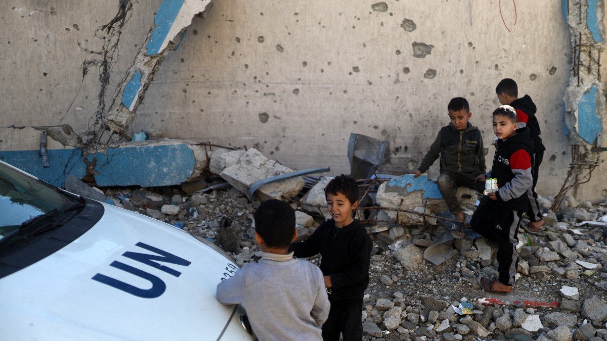 Displaced Palestinian children sit on rubble from a destroyed building near the United Nations Relief and Works Agency for Palestine Refugees in the Near East's (UNRWA) headquarters in Gaza City, Jan. 11, 2026. (AFP File Photo)