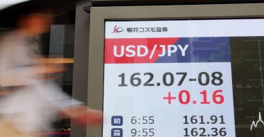 A passerby walks past a currency indicator board in Tokyo, Japan, June 30, 2026. (EPA Photo)