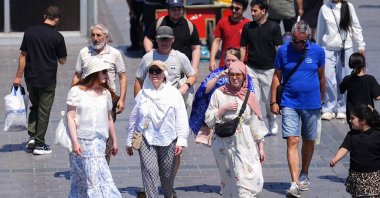 Turkish citizens and tourists walk in the historic Eminönü neighborhood on a hot summer day, Istanbul, Türkiye, June 29, 2026. (AA Photo)