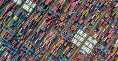 This aerial photo shows containers at a port, Qingdao, China, June 25, 2026. (AFP Photo)