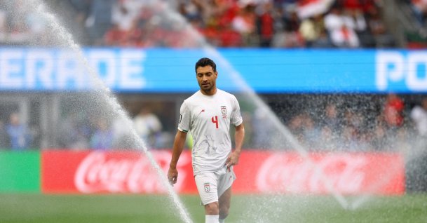 General view of sprinklers watering the pitch and Iran's Shoja Khalilzadeh during the 2026 FIFA World Cup Group G between Egypt and Iran at Seattle Stadium, Seattle, U.S., June 26, 2026. (Reuters Photo)