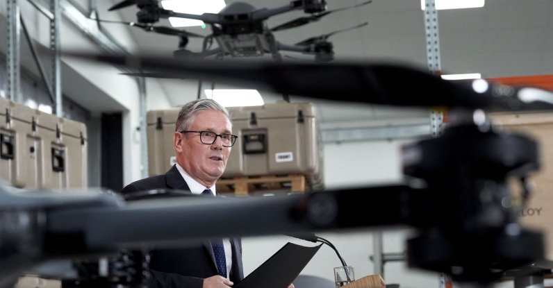 Britain's Prime Minister Keir Starmer stands beneath a display of drones as he delivers a speech in Berkshire, west of London, U.K., June 30, 2026. (AFP Photo)