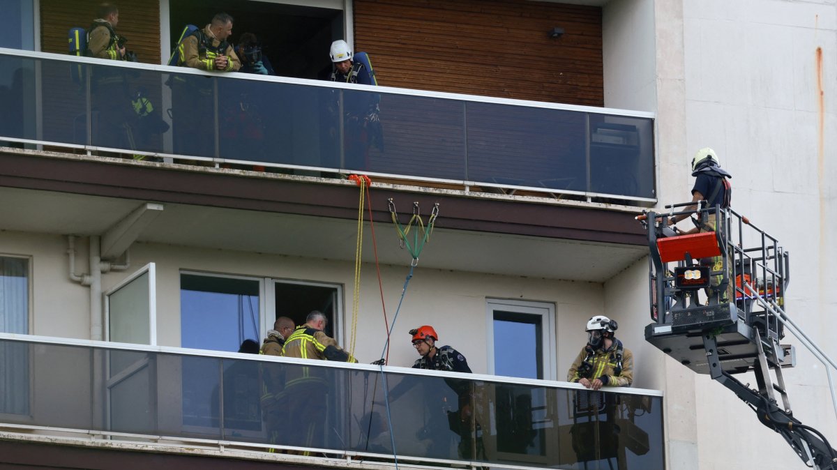 Rescuers work at the site of a fire in an housing building in Antwerp, Belgium, July 1, 2026. (Reuters Photo)