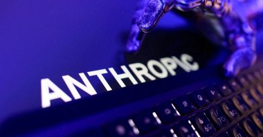 The Anthropic logo, a keyboard and a robotic hand in this illustration, June 5, 2026. (Reuters Photo)