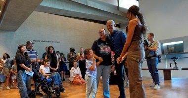 Former U.S. President Barack Obama (2nd R) and former first lady Michelle Obama (R) greet the first group of visitors at the official opening of the Obama Presidential Center, Chicago, U.S., June 19, 2026. (Reuters Photo)