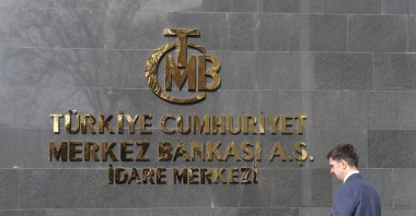 A man walks in front of the headquarters of the Central Bank of the Republic of Türkiye (CBRT), Ankara, Türkiye, Feb. 8, 2024. (EPA Photo)