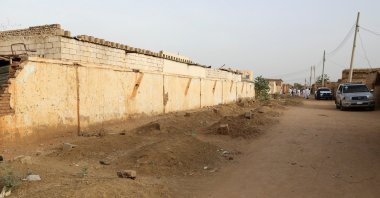 Graves line a street in the Salha neighborhood after the Rapid Support Forces (RSF) barred locals from burying their dead, south of Omdurman, Sudan, June 7, 2026. (Reuters Photo)