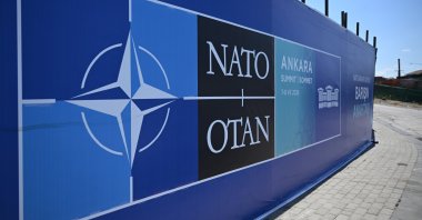 Banners are installed along sidewalks as part of preparations for the NATO summit across Ankara, Türkiye, July 25, 2026. (AA Photo)