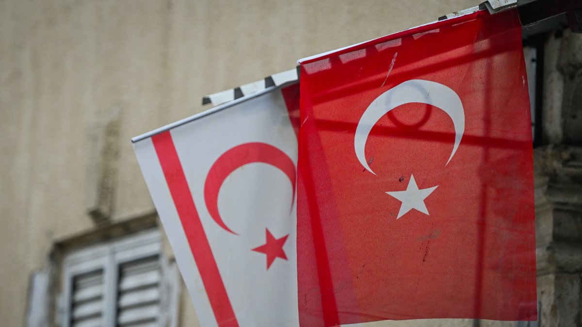 The flags of Türkiye and the Turkish Republic of Northern Cyprus (TRNC) are seen in the northern part of Nicosia, near the U.N.-controlled buffer zone, Cyprus, Oct. 21, 2025. (Getty Images Photo)