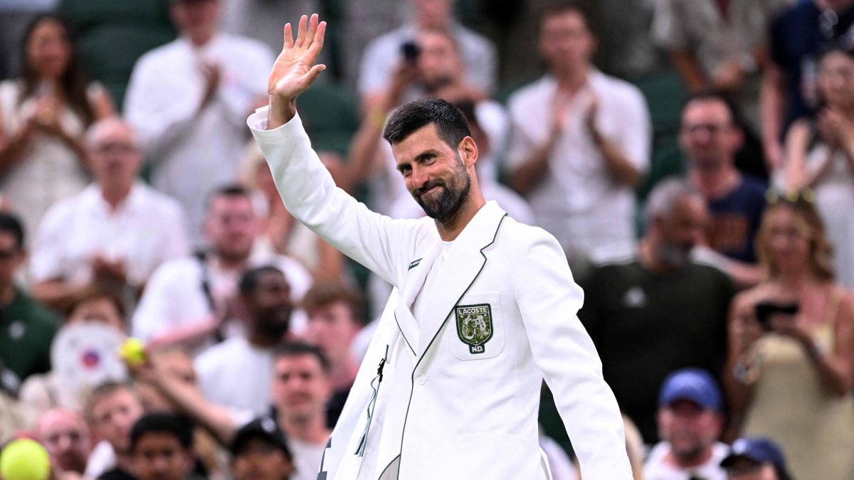 Serbia's Novak Djokovic waves as he leaves the court after defeating Greece's Stefanos Tsitsipas during their men's singles second-round tennis match on the third day of the 2026 Wimbledon Championships at The All England Lawn Tennis and Croquet Club in Wimbledon, London, U.S., July 1, 2026. (AFP Photo)