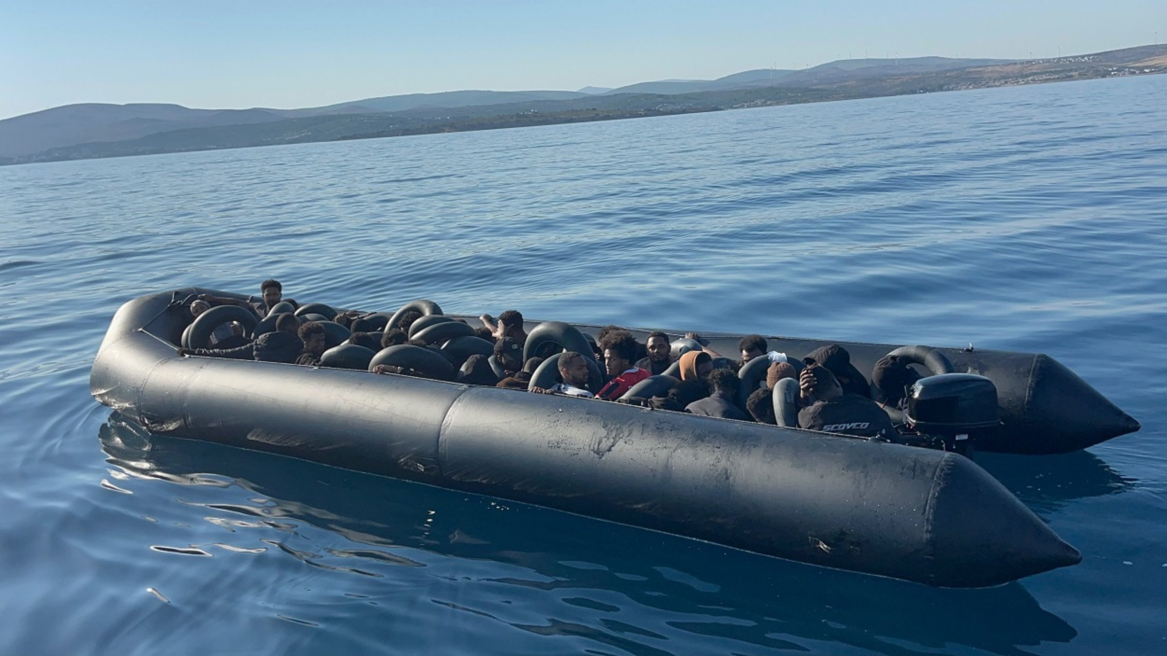 A group of irregular migrants is intercepted in a boat off Çeşme, Izmir, western Türkiye, July 1, 2026. (AA Photo)