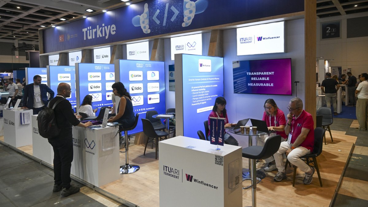 Türkiye’s Investment and Finance Office staff welcome visitors at the national pavilion during a GITEX AI event, Berlin, Germany, July 2, 2026. (AA Photo)