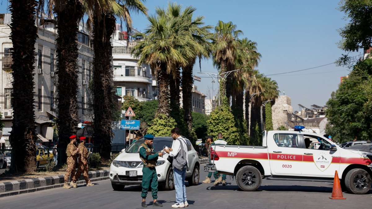 A police vehicle near the site of what Syrian state media reported was a blast at a cafe in central Damascus, Syria, July 2, 2026. REUTERS/Yamaam Al Shaar