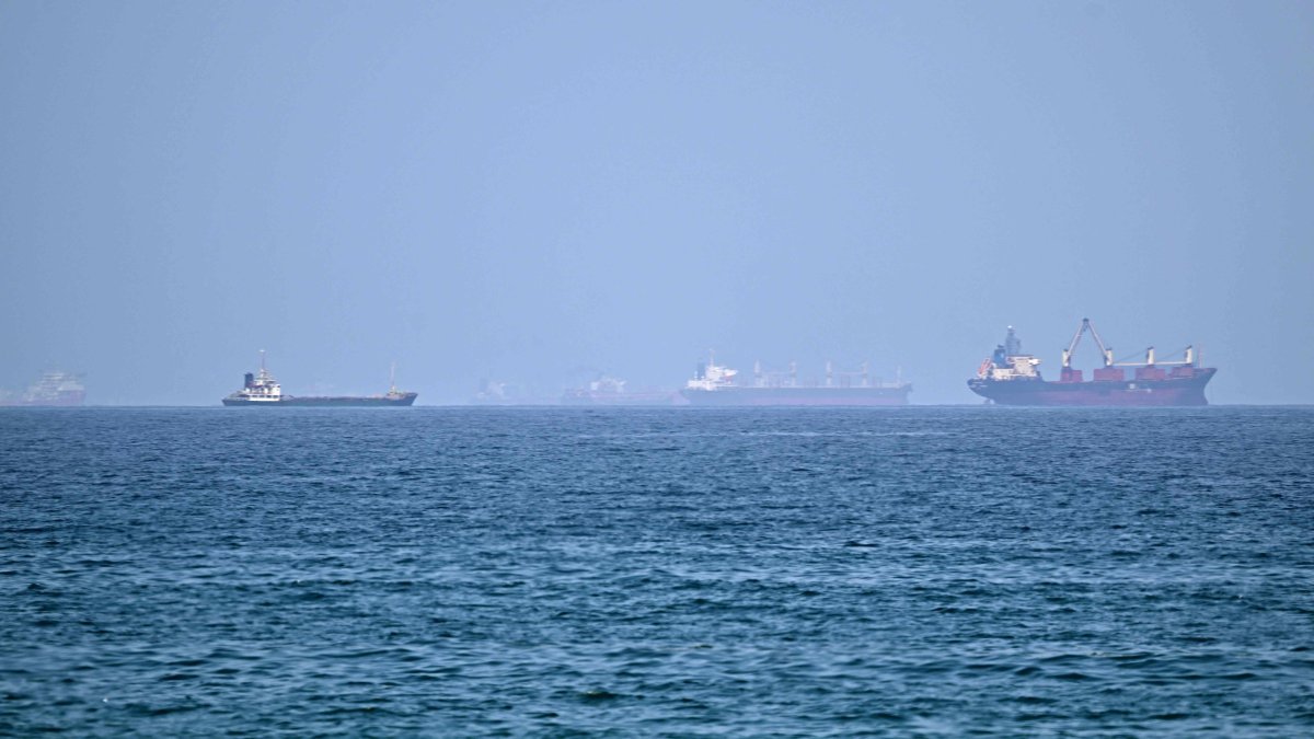 Vessels are pictured off coast of the Khor Fakkan Container Terminal, the only natural deep-sea port in the region and one of the major container ports in Sharjah Emirate, along the Gulf of Oman, June 28, 2026. (AFP Photo)