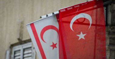 The flags of Türkiye and the Turkish Republic of Northern Cyprus (TRNC) are seen in the northern part of Nicosia, near the U.N.-controlled buffer zone, Cyprus, Oct. 21, 2025. (Getty Images Photo)