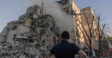 A man looks at a residential building damaged in a Russian air attack on Kyiv, Ukraine, July 2, 2026. (AFP Photo)