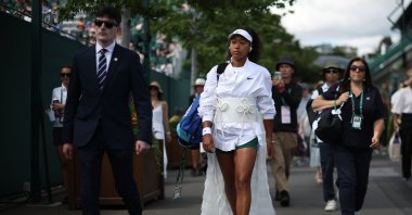 Japan's Naomi Osaka walks to court 2 for their women's singles second-round tennis match on the third day of the 2026 Wimbledon Championships at The All England Lawn Tennis and Croquet Club in Wimbledon, London, U.K., July 1, 2026. (AFP Photo)