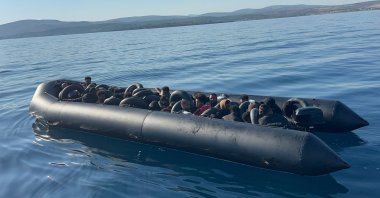 A group of irregular migrants is intercepted in a boat off Çeşme, Izmir, western Türkiye, July 1, 2026. (AA Photo)