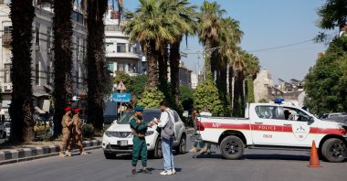 A police vehicle near the site of what Syrian state media reported was a blast at a cafe in central Damascus, Syria, July 2, 2026. REUTERS/Yamaam Al Shaar