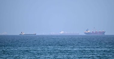 Vessels are pictured off coast of the Khor Fakkan Container Terminal, the only natural deep-sea port in the region and one of the major container ports in Sharjah Emirate, along the Gulf of Oman, June 28, 2026. (AFP Photo)