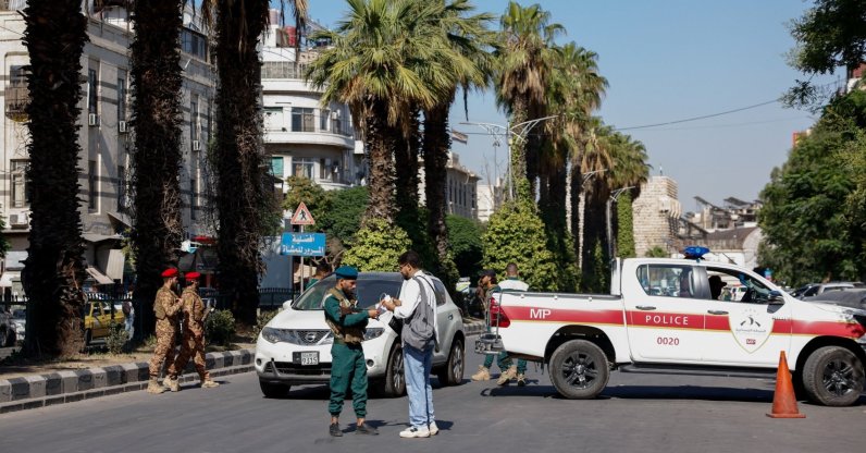 A police vehicle near the site of what Syrian state media reported was a blast at a cafe in central Damascus, Syria, July 2, 2026. REUTERS/Yamaam Al Shaar