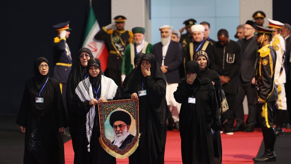 Women holding a portrait of late Iranian Supreme Leader Ayatollah Ali Khamenei pay their respects before his state funeral at the Imam Khomeini Hussainiyah, Tehran, Iran, July 3, 2026. (EPA Photo)