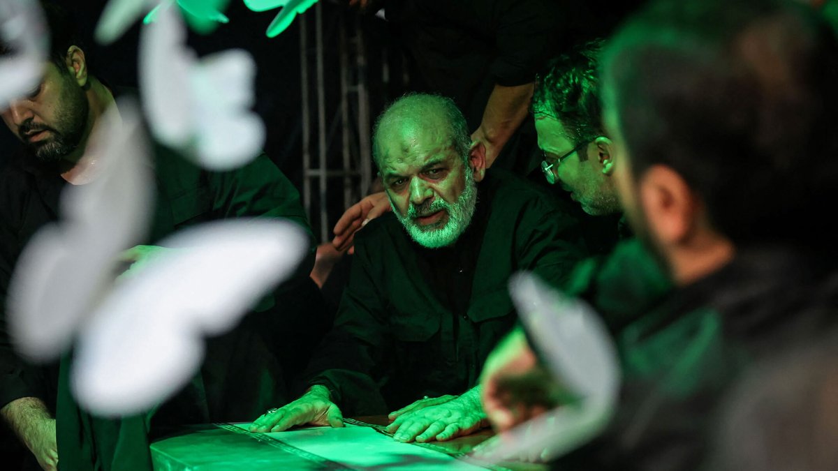 Iran Revolutionary Guard Corps Chief Ahmad Vahidi (C) pays respect at the coffin of Iran's slain supreme leader Ali Khamenei during a ceremony ahead of his funeral, Tehran, Iran, July 3, 2026. (AFP Photo)