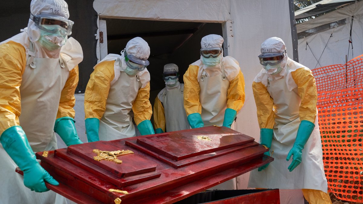 Staff carry a coffin for a victim of Ebola at the hospital in Mongbwalu, Ituri, DRC, June 26, 2026. (EPA Photo)