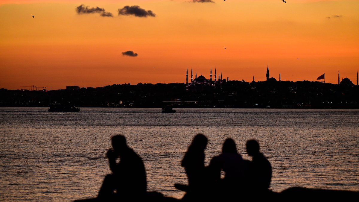 People spend time along the Kadıköy waterfront at sunset, Istanbul, Türkiye, June 18, 2026. (AA Photo) 