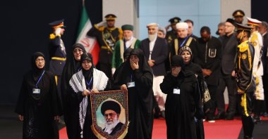 Women holding a portrait of late Iranian Supreme Leader Ayatollah Ali Khamenei pay their respects before his state funeral at the Imam Khomeini Hussainiyah, Tehran, Iran, July 3, 2026. (EPA Photo)