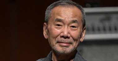 Japanese author Haruki Murakami poses during a photo call following a performance entitled the “Haruki Murakami produce Murakami JAM vol.3 – A hot and gentle fusion night,” at the Sumida Triphony Hall, Tokyo, Japan, June 29, 2024. (AFP Photo)