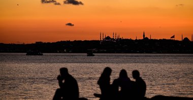 People spend time along the Kadıköy waterfront at sunset, Istanbul, Türkiye, June 18, 2026. (AA Photo) 