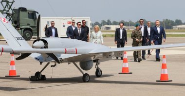 Polish President Karol Nawrocki (R) looks at a TB2 Bayraktar combat drone during its demonstration at Incirlik Air Base, Incirlik, Türkiye, June 24, 2026. (EPA Photo)