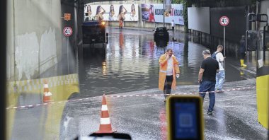 People walk through an underpass in Levent, which was closed to traffic due to flooding, Istanbul, Türkiye, July 4, 206. (AA Photo)