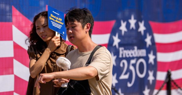 Visitors try to stay cool as they walk along the National Mall as the nation celebrates America's 250th anniversary, Washington, U.S., July 3, 2026. (AFP Photo)