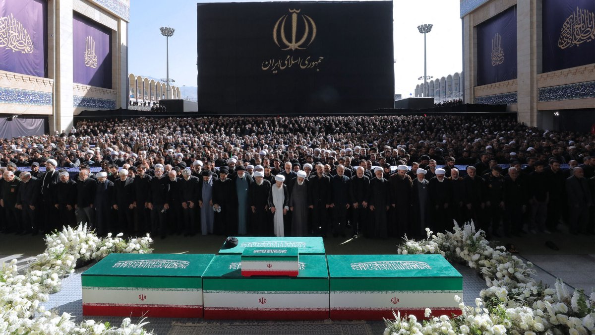 Iranian officials pray next to the coffins of Iran's slain supreme leader, Ayatollah Ali Khamenei, and his family members at the Grand Mosalla during the second day of his funeral ceremonies in Tehran, Iran, July 5, 2026. (AFP Photo)