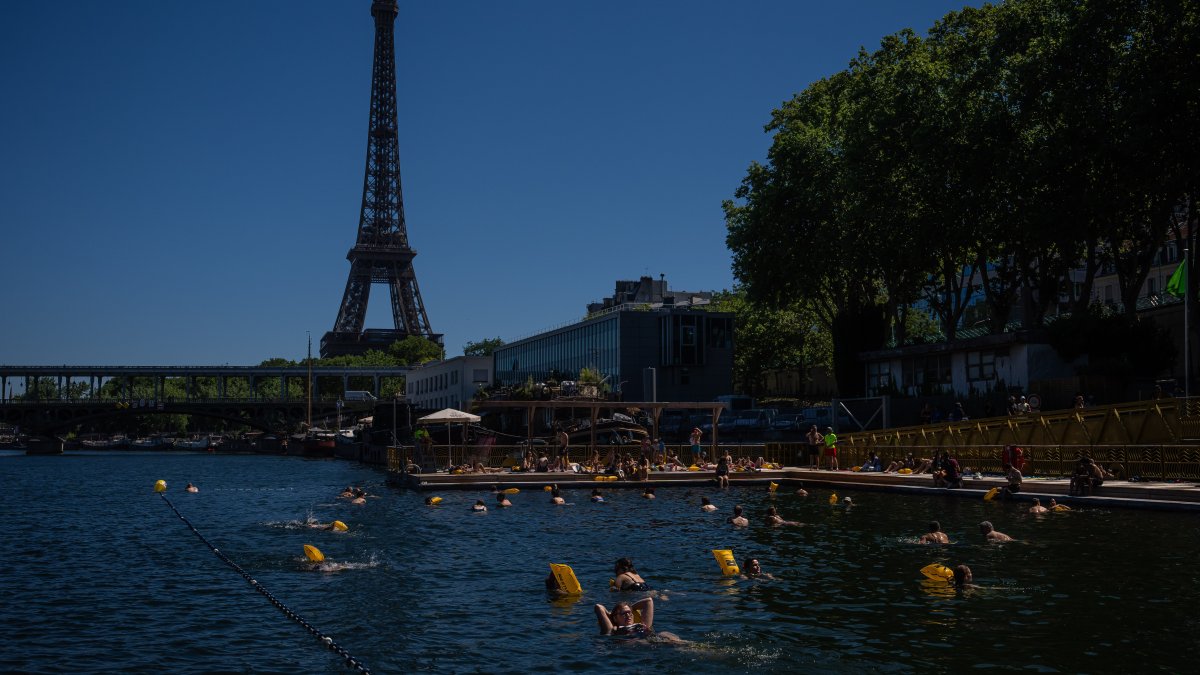 People swimming in the Seine River, Paris, France, July 4, 2026. (AP Photo)