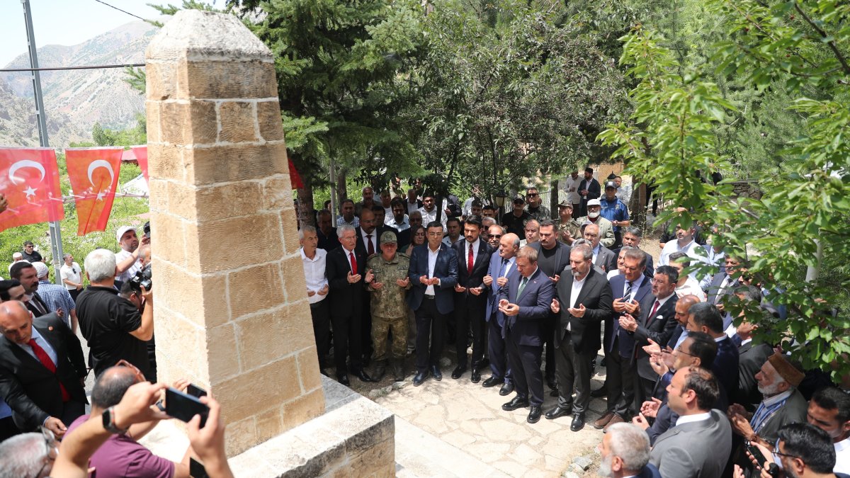 People recite prayers around a monument erected in memory of the victims of the Başbağlar massacre, Erzincan, eastern Türkiye, July 5, 2026. (AA Photo)