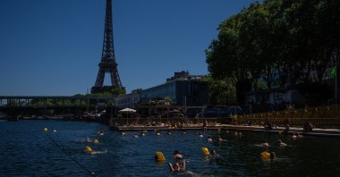 People swimming in the Seine River, Paris, France, July 4, 2026. (AP Photo)