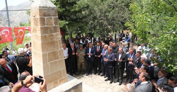 People recite prayers around a monument erected in memory of the victims of the Başbağlar massacre, Erzincan, eastern Türkiye, July 5, 2026. (AA Photo)