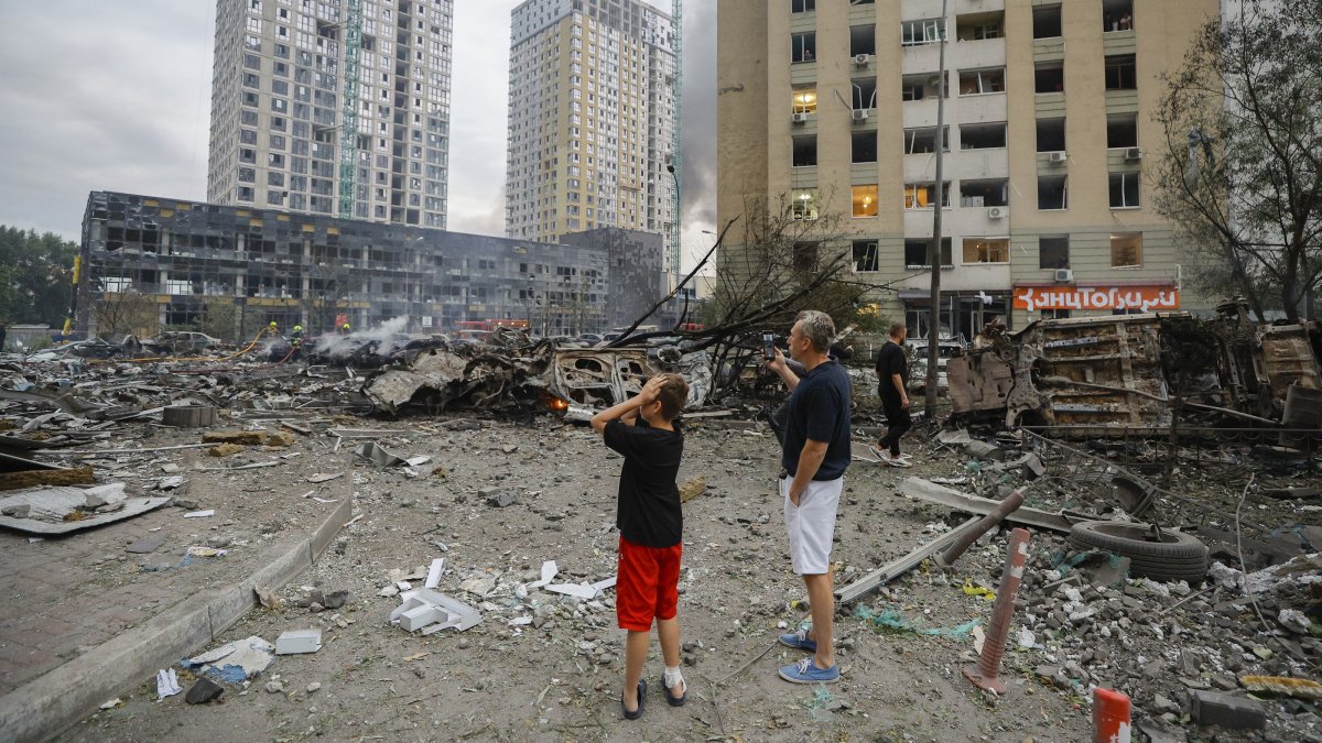 Locals react at the site of a Russian strike on a residential area in Kyiv, Ukraine, July 6, 2026. (EPA Photo)