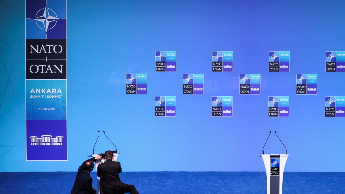 People adjust a lectern in the main press conference room a day before the start of the NATO summit in Ankara, Türkiye, July 6, 2026. (Reuters Photo)