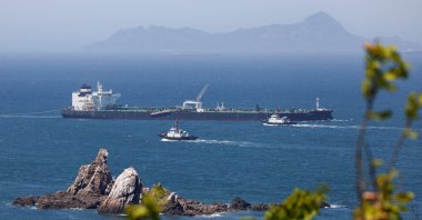 Tugboats guide the crude oil tanker Odessa, carrying UAE crude after passing through the Strait of Hormuz, navigates the waters at Daesan port, Seosan, South Korea, May 8, 2026. (Reuters Photo)