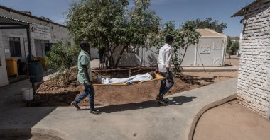 Medical workers carry an injured boy on a stretcher from the operating theatre to the intensive care unit at the MSF-run Paris Hospital in Tawila, north Darfur, Sudan, Feb. 28, 2026. (Getty Images Photo) 