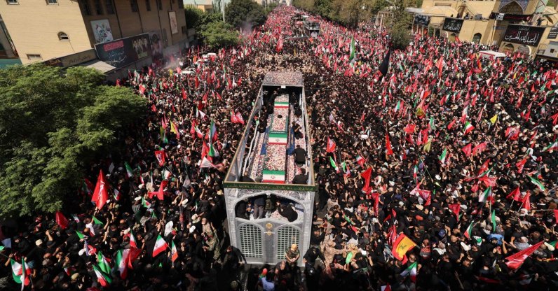 People gather along a street during the funeral procession of Iran's slain Supreme Leader Ali Khamenei and his family members in Tehran, Iran, July 6, 2026. (AFP Photo)